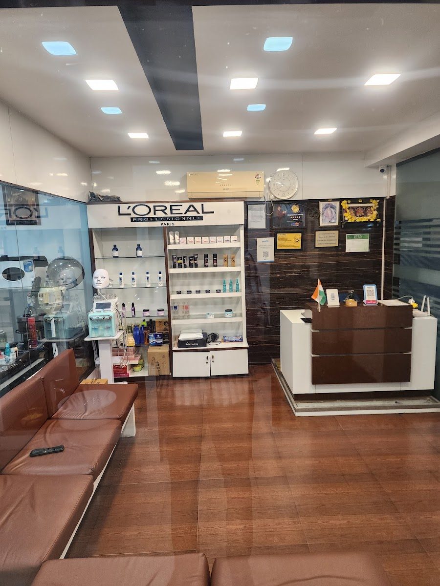 L'Oréal Professionnel retail wall and reception desk inside Dreams Men's Salon.