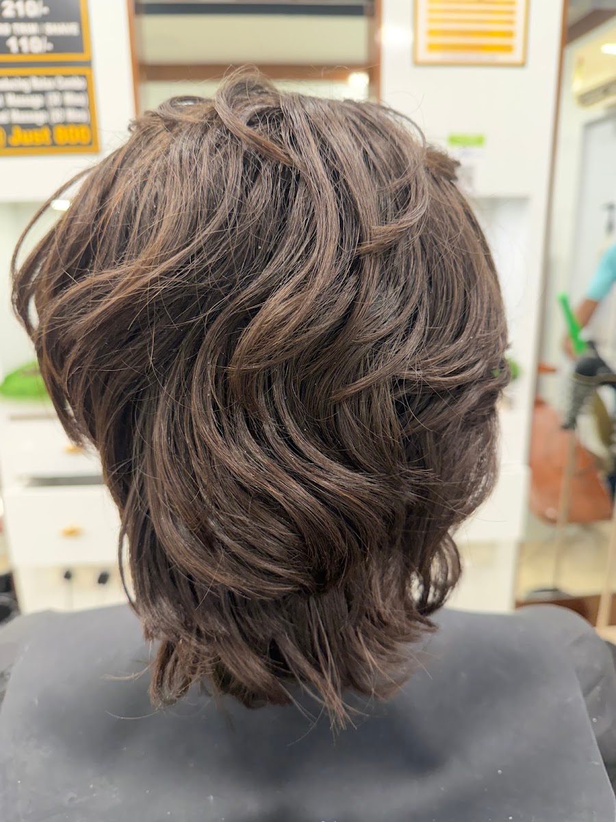 Ash-toned highlights on textured length, coloured with L'Oréal at Dreams Men's Salon.