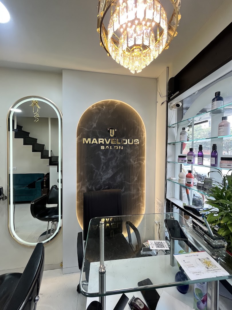 A halo-lit arched display wall with retail shelves inside the salon
