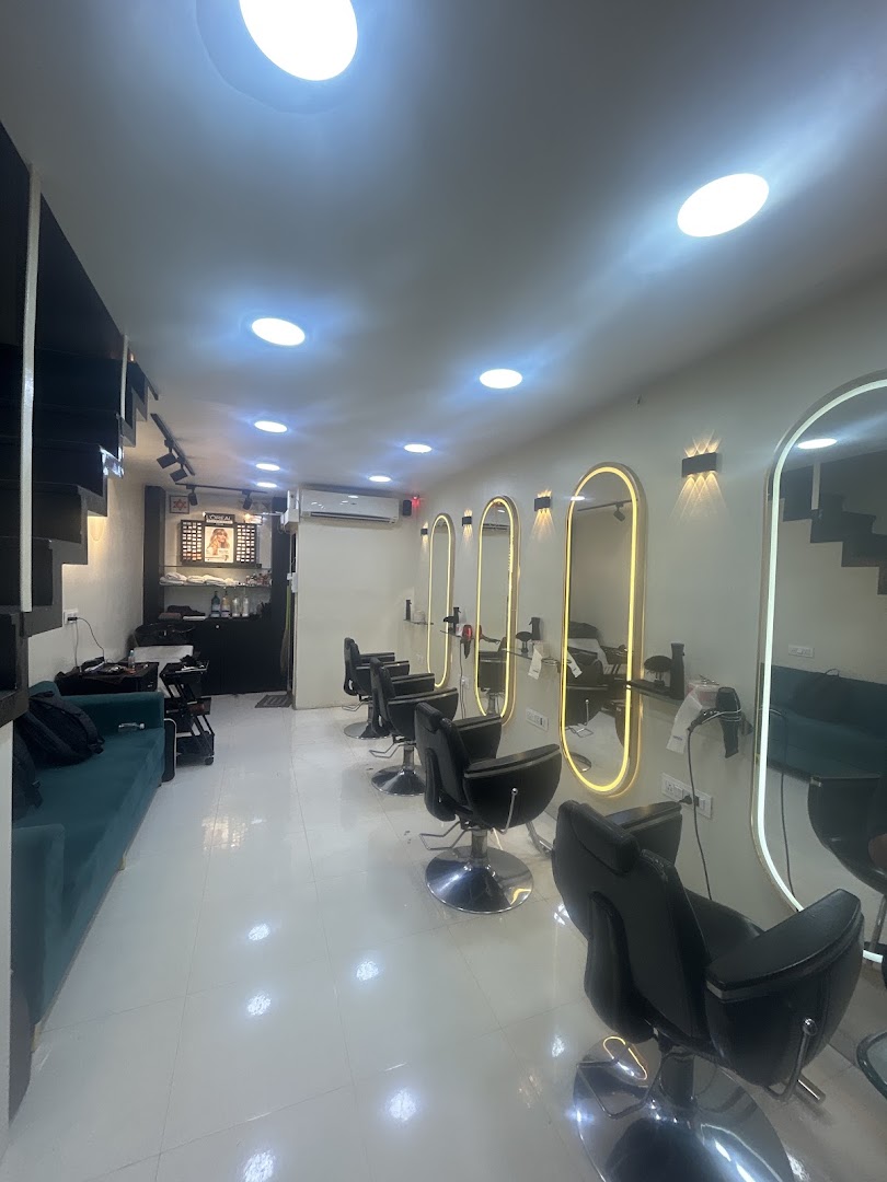 The salon floor: a row of gold-lit arched mirrors and styling chairs